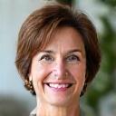 Portrait of Dr. Evelyn Reed, a cheerful woman in her 50s with a warm smile.