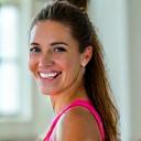 Headshot of Coach Sarah Jenkins, a vibrant female fitness coach in her early 40s, looking energetic and approachable.